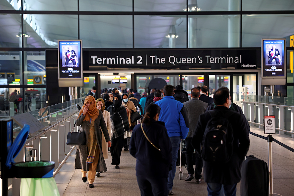 People queue to enter terminal 2, as tighter rules for international travellers start, at Heathrow Airport, amid the spread of the coronavirus disease pandemic, London, Britain, January 18, 2021. u00e2u20acu201d Reuters picnn