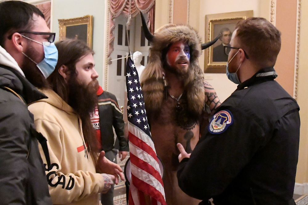 Jacob Anthony Chansley of Arizona speaks with a US Capitol Police officer after supporters of President Donald Trump occupied the US Capitol in Washington, US, January 6, 2021. u00e2u20acu201d Reuters pic 