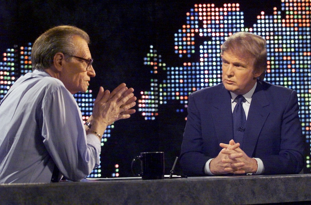 Billionaire real estate developer Donald Trump (right) talks with host Larry King after taping a segment of King’s CNN talk show, in New York, US, October 7, 1999. — Reuters pic