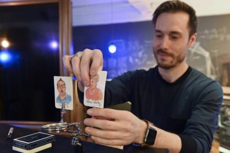 Canadian illusionist Luc Langevin sets up a card trick at his Montreal studio with a deck featuring images of French celebrities.u00e2u20acu201d ETX Studio picnnnn