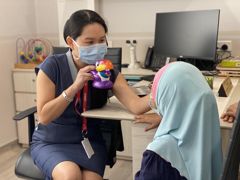 Sunway Medical Centre Velocity's (SMCV) Dr Fiona Chew performing the orthoptics assessment to check the squint angle on Mia Syuhada Sabdani. u00e2u20acu201d Photo by Jasmin Zainal 