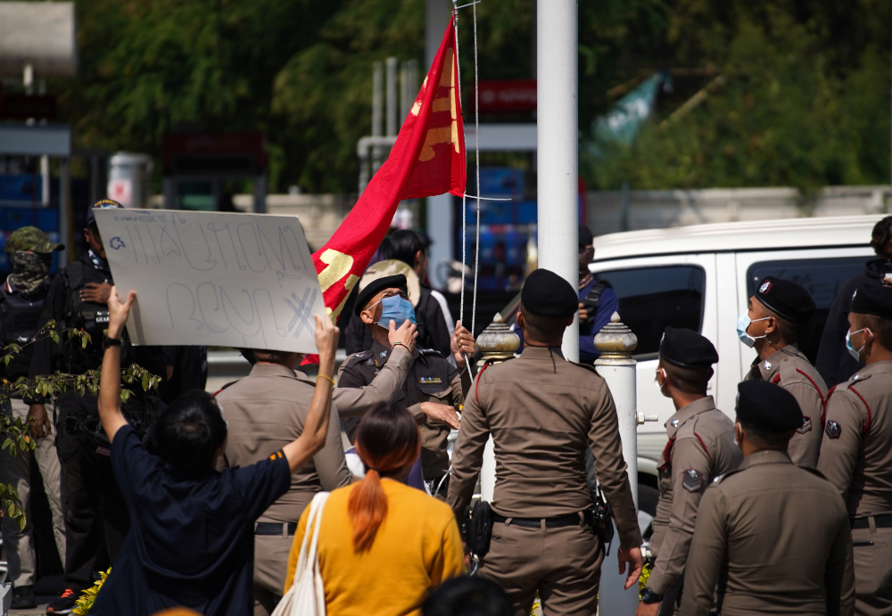 A protester holds a placard after Chaiyapon Danothai arrived to report himself to police summons at the Khlong Luang police station in Pathum Thani province, Thailand, January 15, 2021. u00e2u20acu201d Reuters pic