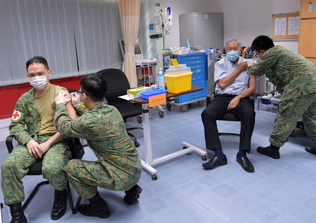Defence Minister Ng Eng Hen (second, right) received his first dose of the vaccine on January 14, 2021. Also getting the jab was chief of the Singapore Armed Forces Medical Corps, Colonel (Dr) Lo Hong Yee (far left). u00e2u20acu2022 TODAY pic