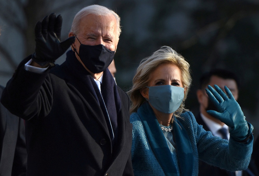 US President Joe Biden and first lady Jill Biden wave at the crowd as they head to the White House after the 2021 inauguration, in Washington January 21, 2021. u00e2u20acu2022 Reuters pic