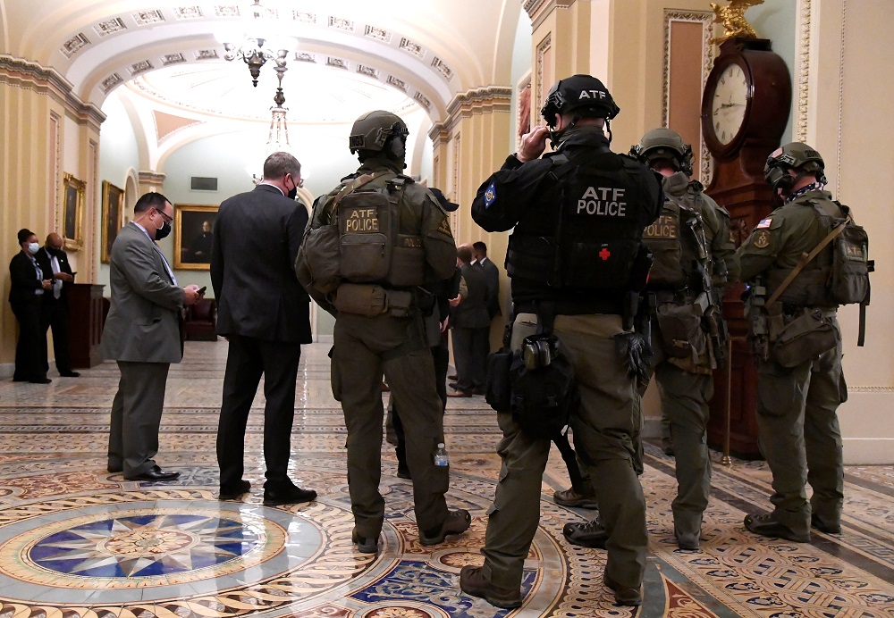 Police with the Alcohol, Tobacco and Firearms (ATF) maintain security in the halls of the Senate in the US Capitol, as a joint session continues in the House to certify President-elect Joe Biden, in Washington January 6, 2021. u00e2u20acu2022 Reuters pic