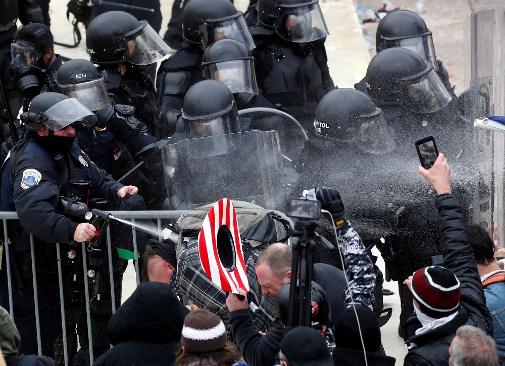 Police officers release pepper spray on pro-Trump protesters during clashes with Capitol police at a rally to contest the certification of the 2020 US presidential election results by the US Congress in Washington January 6, 2021. u00e2u20acu2022 Reuters pic