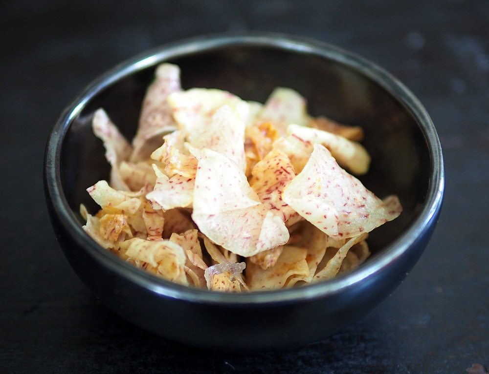 For Chinese New Year, they are making crispy yam chips for sale.