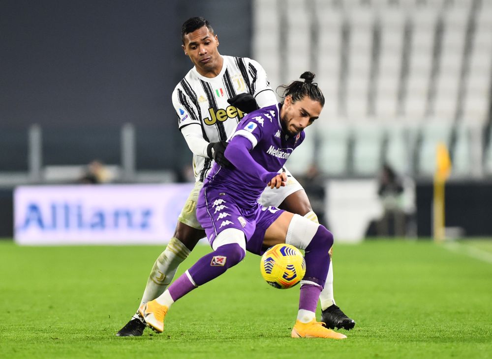 Juventus' Alex Sandro in action with Fiorentina's Martin Caceres at the Allianz Stadium in Turin December 22, 2020. u00e2u20acu201d Reuters picnn
