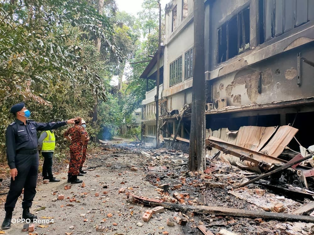 Police and Fire Dept personnel inspect the damage to The Andaman resort in Langkawi which caught fire twice yesterday. u00e2u20acu2022 Picture via Facebook