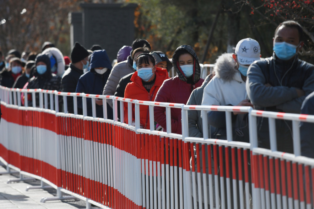 Residents line up to be tested for Covid-19 in Beijing January 11, 2021, following new cases of the virus emerging in the province which surrounds Beijing. u00e2u20acu201d AFP picnn