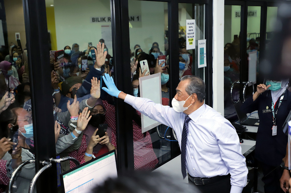 Prime Minister Tan Sri Muhyiddin Yassin meets Covid-19 patients at the MAEPS 2.0 Integrated Hospital in Serdang January 19, 2021. u00e2u20acu201d Bernama pic