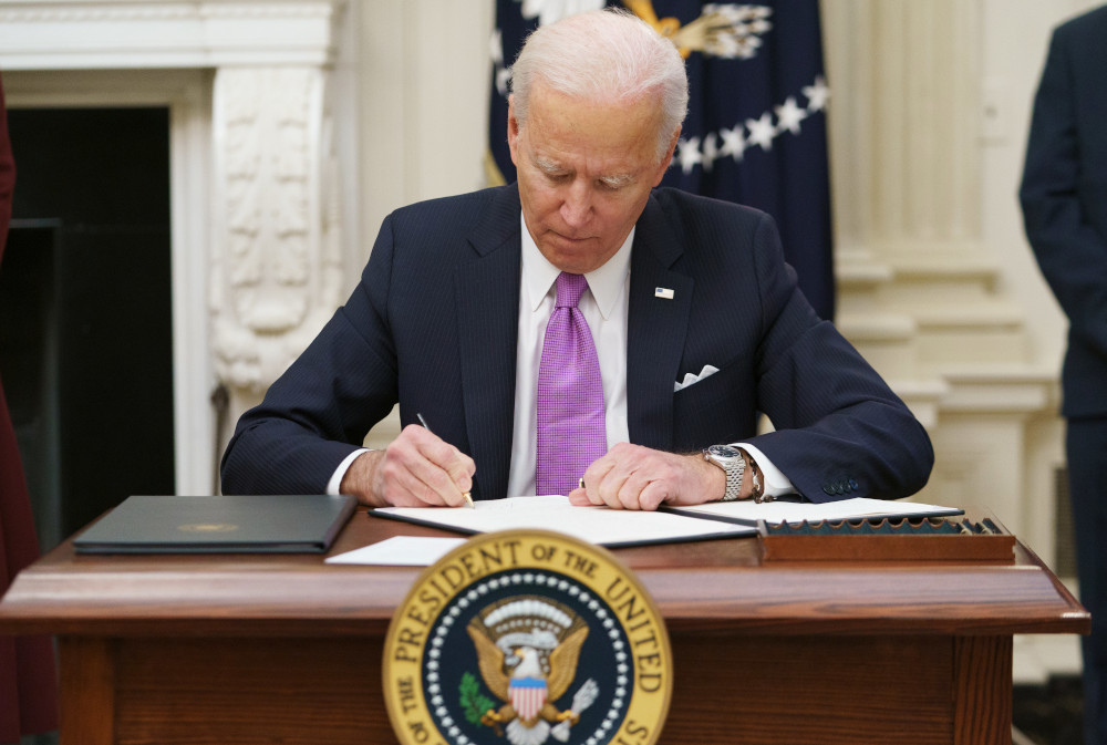 US President Joe Biden signs executive orders as part of the Covid-19 response in the State Dining Room of the White House in Washington, DC, January 21, 2021. u00e2u20acu201d AFP picnn