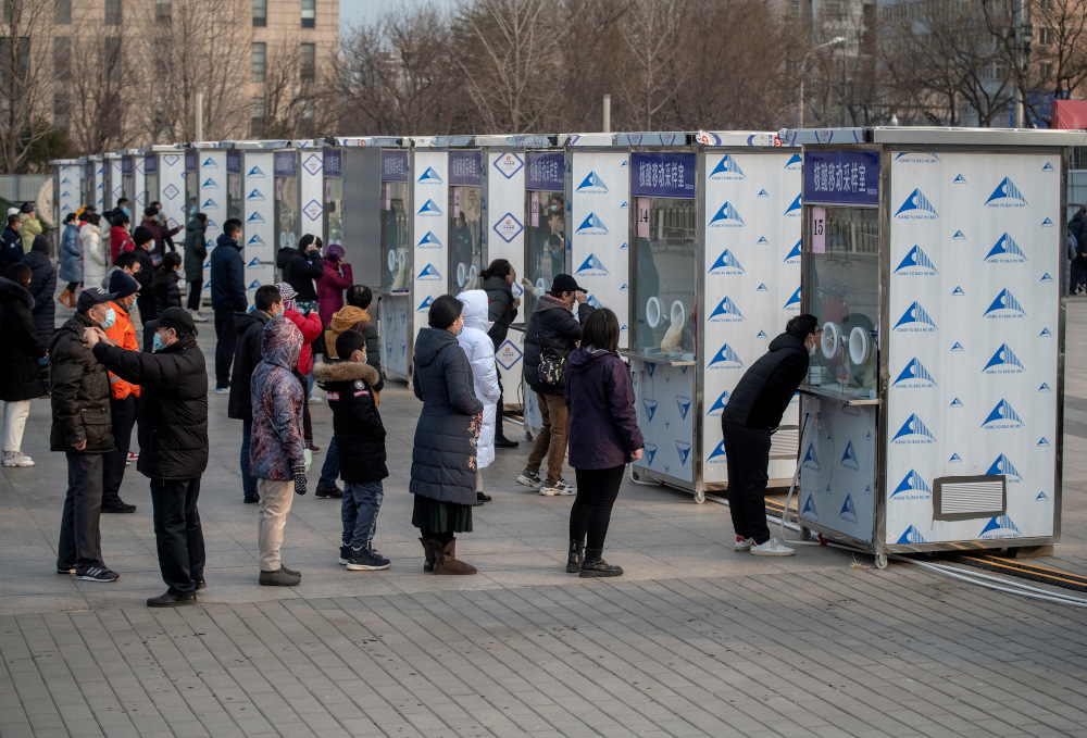 People line up to be tested for Covid-19 in Beijing January 23, 2021, part of a drive to test two million people in 48 hours as the city rushes to snuff out a new local cluster of cases believed to be linked to a more contagious virus variant. u00e2u20acu201d AFP pic