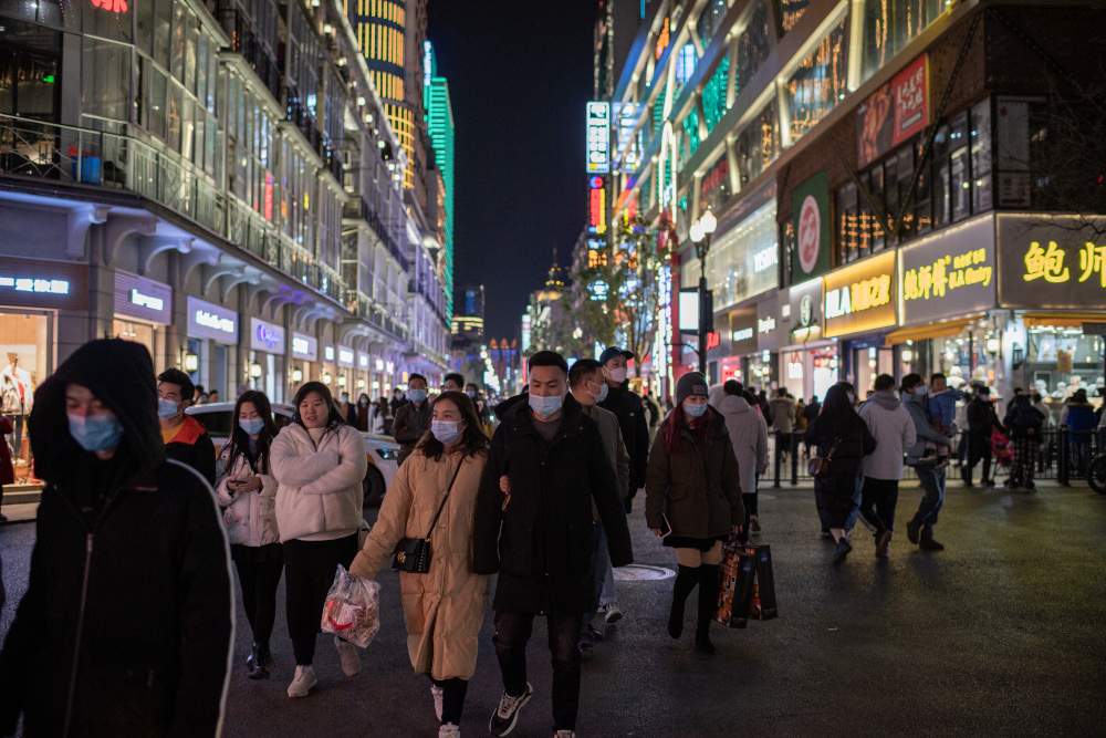 People wearing face masks walk on Jianghan street in Wuhan January 10, 2021, the eve of the first anniversary of China confirming its first death from the Covid-19 coronavirus. u00e2u20acu201d AFP pic
