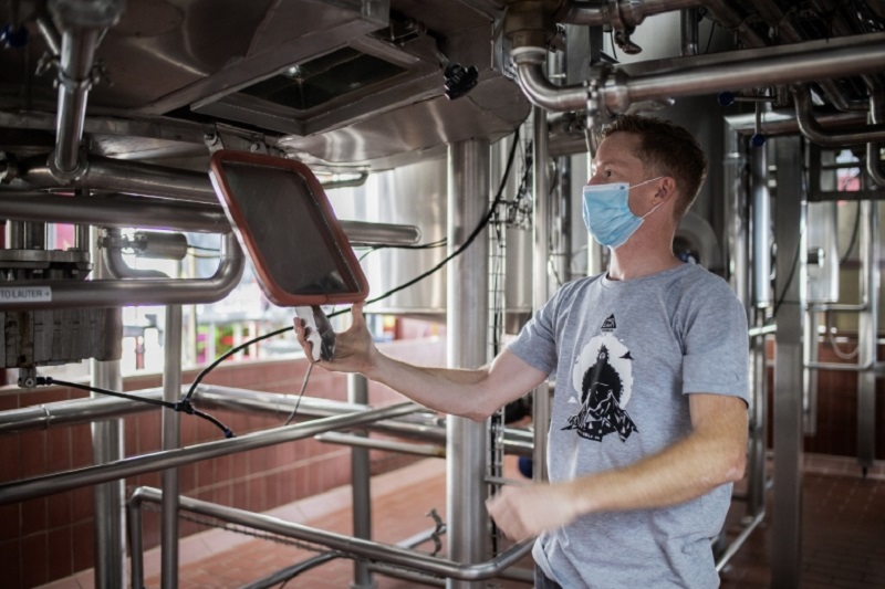 The owner of Mad Giant Brewery, Eben Uys, checks the temperature of beer tanks in his factory, in Newtown, Johannesburg. u00e2u20acu2022 AFP pic