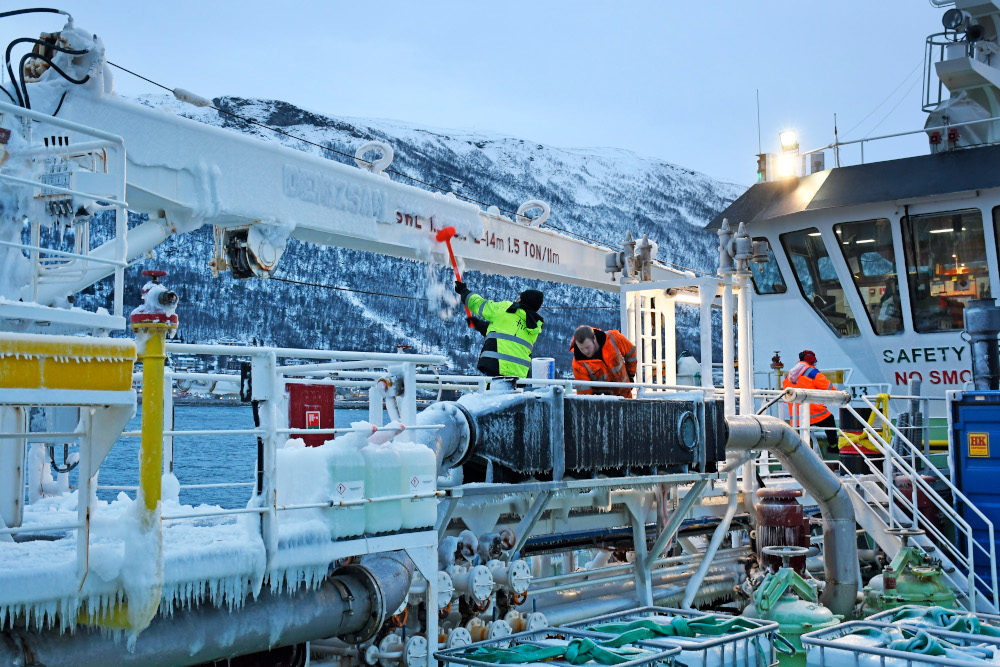 The crew remove ice on board a fishing vessel moored in Tromso harbour, Norway, January 22, 2021, as extreme weather u00e2u20acu02dcFranku00e2u20acu2122 with strong winds and gusts of wind hits the country. u00e2u20acu201d AFP pic 