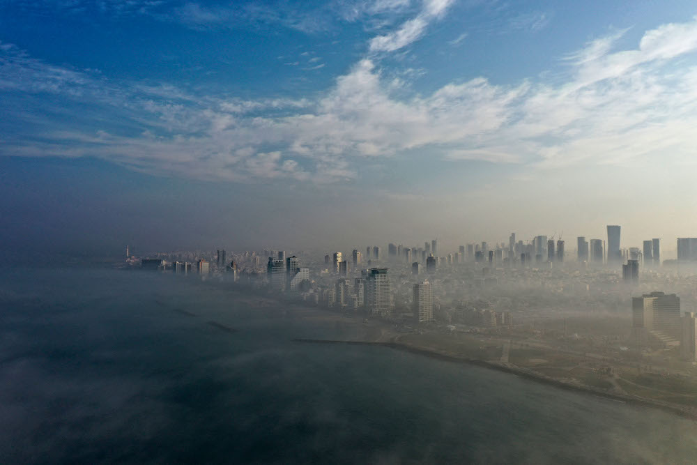 Morning fog blankets the Israeli city of Tel Aviv on the Mediterranean seashore, January 4, 2021. u00e2u20acu201d AFP pic 