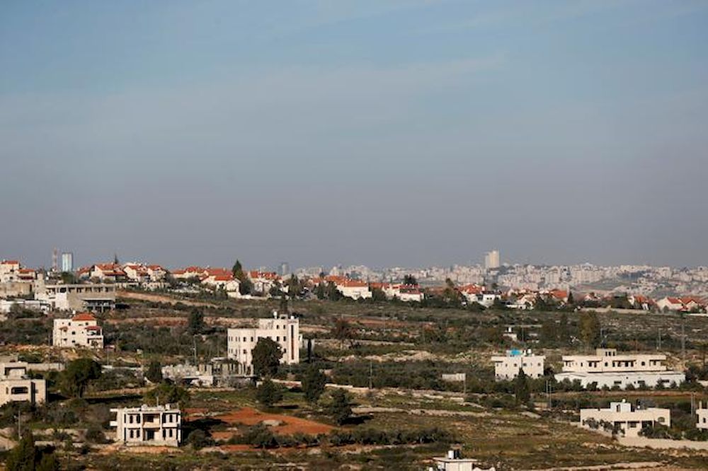 A view shows Palestinian houses as an Israeli settlement is seen in the background near Ramallah in the Israeli-occupied West Bank, January 11, 2021. u00e2u20acu201d Reuters pic
