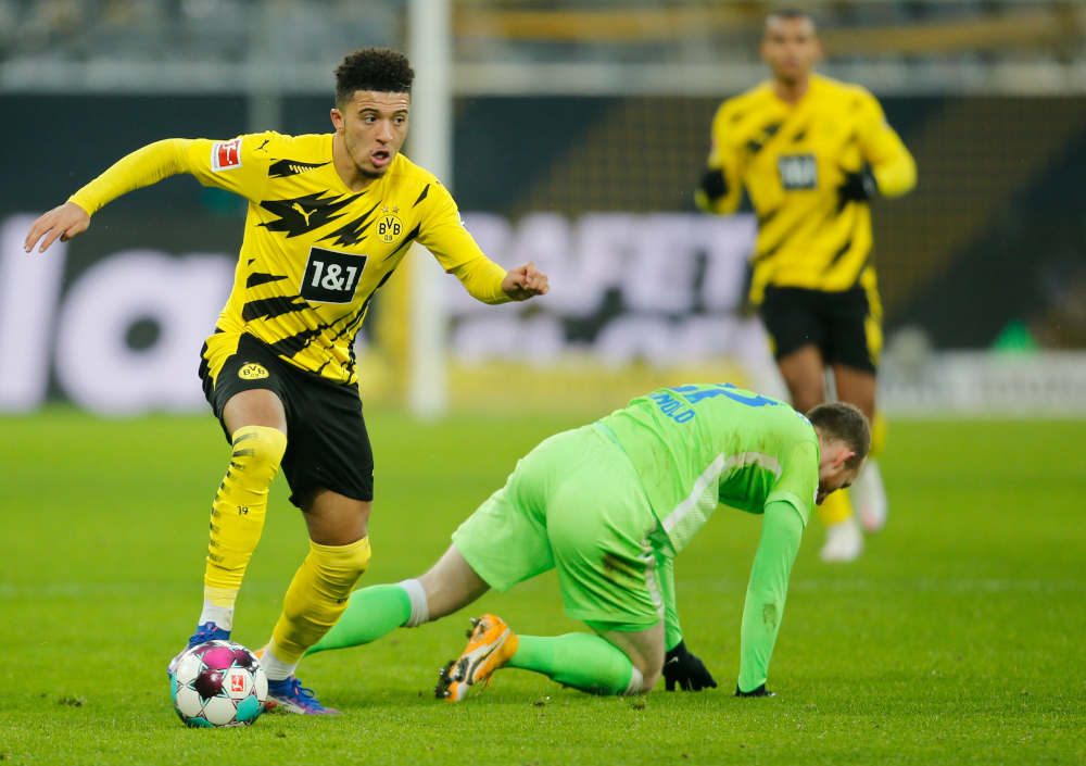 Dortmund midfielder Jadon Sancho (left) and Wolfsburg midfielder Maximilian Arnold vie for the ball during the German first division Bundesliga football match Borussia Dortmund v VfL Wolfsburg January 3, 2021 in Dortmund, western Germany. u00e2u20acu201d AFP picnn