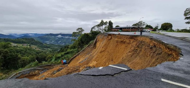 Part of the road in front of the entrance to the Kinabalu National Park, Malaysia's first World Heritage Site, has collapsed following unrelenting rain over the past few days. u00e2u20acu201d Picture via Facebook