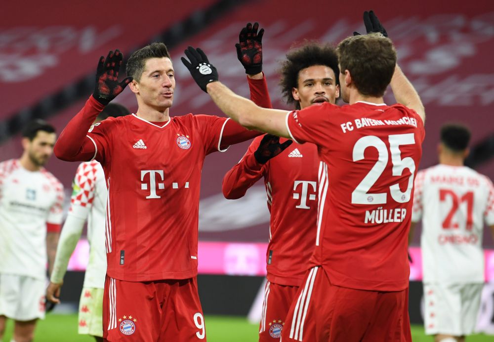 Bayern Munich's Robert Lewandowski (left) celebrates scoring their fifth goal with Leroy Sane and Thomas Muller at the Allianz Arena, Munich January 3, 2021. u00e2u20acu201d Reuters pic