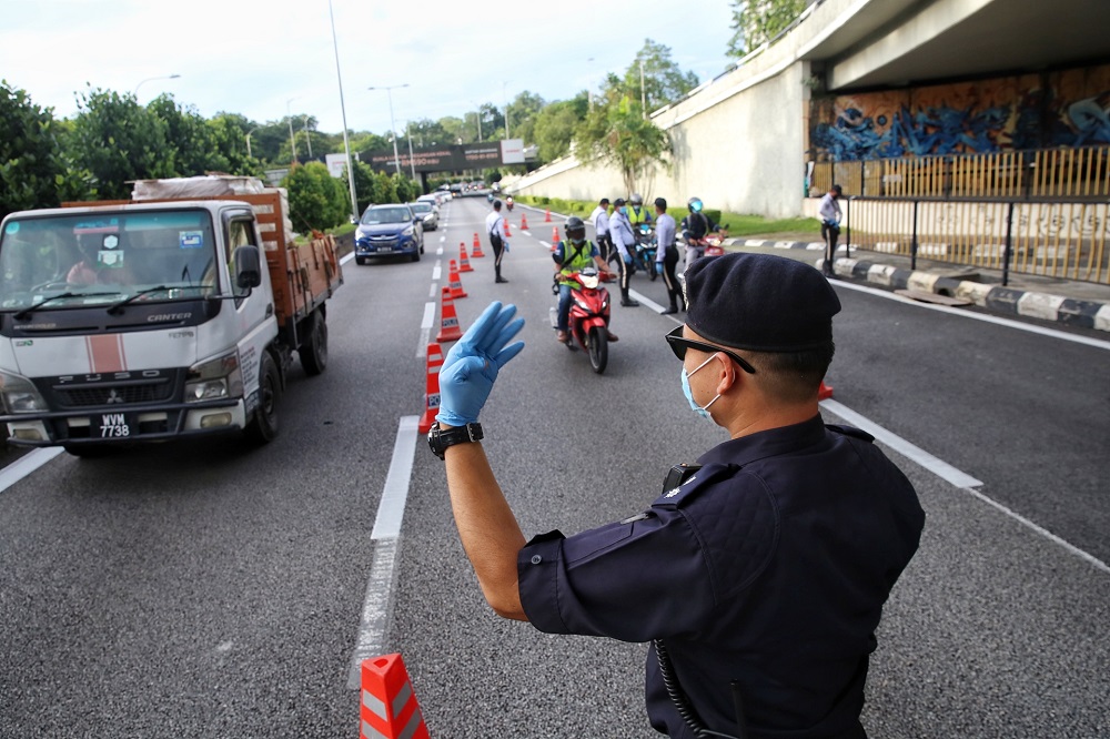 Police man a roadblock along Jalan Syed Putra in Kuala Lumpur January 13, 2021. u00e2u20acu2022 Picture by Choo Choy May