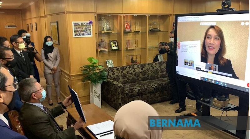 Health Minister Datuk Seri Dr Adham Baba and Country Manager of Pfizer (Malaysia & Brunei) Luksanawan Thangpaibool during the signing of the manufacturing and supply agreement for Pfizer Covid-19 vaccines in Malaysia. u00e2u20acu201d Picture via Twitter/Bernama