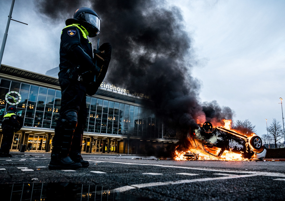 A car has been set on fire in front of the train station, January 24, 2021 in Eindhoven, the Netherlands, after a rally by several hundreds of people against the corona policy. u00e2u20acu201d AFP pic 