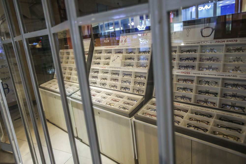 An optometrist with its shutters down at the Mid Valley Megamall in Kuala Lumpur January 14, 2020. u00e2u20acu201d Picture by Hari Anggara