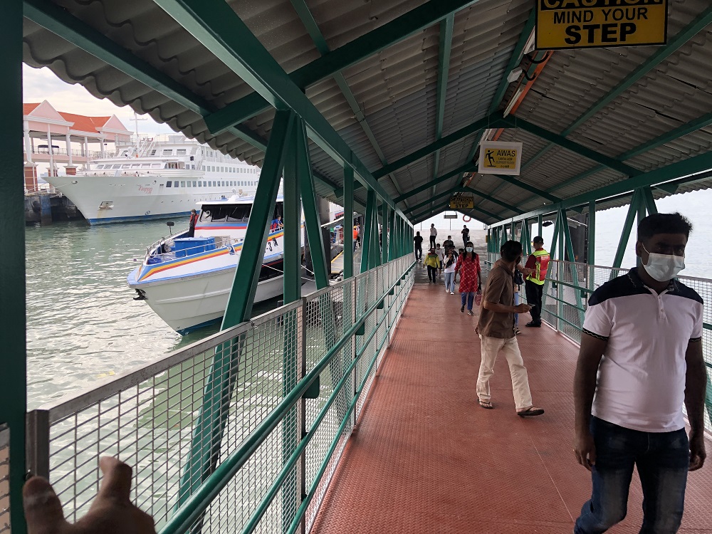 Passengers alighting from the fast boat at Swettenham Pier Cruise Terminal in George Town January 1, 2020. 