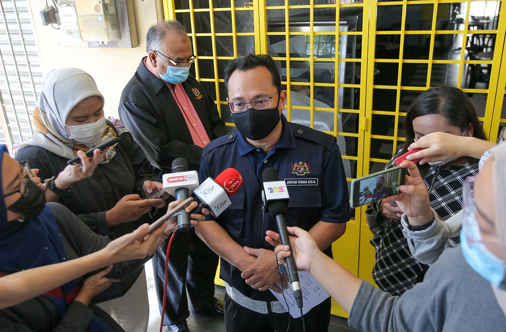 The Perak Department of Labour Peninsular Malaysia (JTKSM) director Muhamad Fauzi Abd Ghani speaks to reporters when met outside the factory workeru00e2u20acu2122s dorm in Chemor, Perak January 13, 2021. u00e2u20acu2022 Picture by Farhan Najib