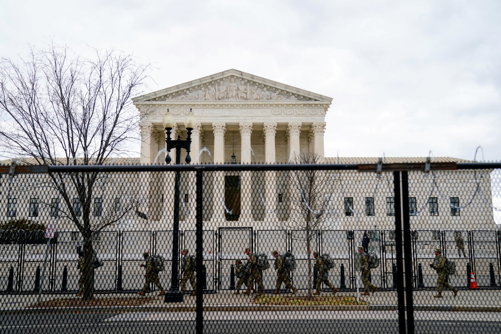 National Guard troops walk behind fencing in front of the US Supreme Court as security tightens ahead of presidential inaugural events on Capitol Hill in Washington January 17, 2021. u00e2u20acu201d Reuters pic