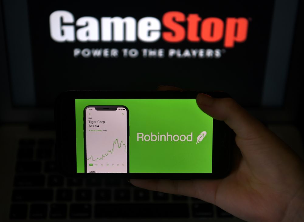 This photo illustration shows the logos of video game retail store GameStop and trading application Robinhood in a computer and on a mobile phone in Arlington, Virginia on January 28, 2021. u00e2u20acu2022 AFP pic
