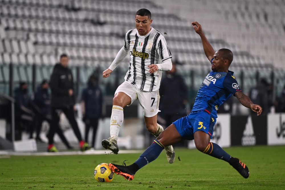 Udinese defender Samir tackles Juventus forward Cristiano Ronaldo during the Italian Serie A football match Juventus vs Udinese January 3, 2021 at the Juventus stadium in Turin. u00e2u20acu201d AFP pic 