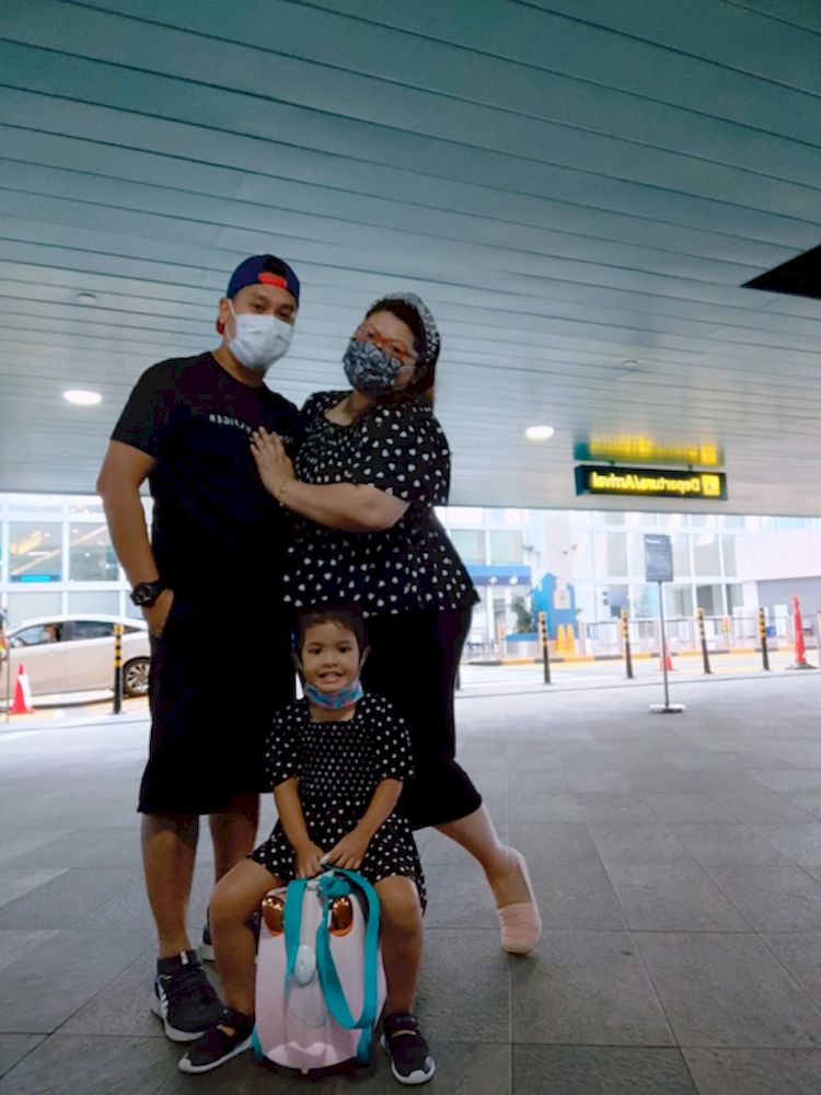 Ms Safawati Latif, her husband Muhammad Fadinoh Ismail and their daughter as they prepared to leave on the cruise. — Photo courtesy of Safawati Latif