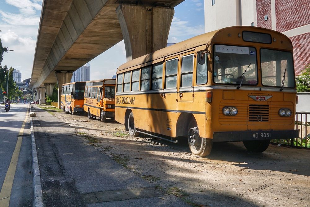 School buses are seen parked by the roadside in Kuala Lumpur amid the movement control order January 20,2021. u00e2u20acu201d Picture by Ahmad Zamzahuri