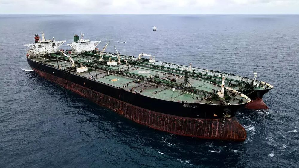 This handout aerial photo taken on January 24, 2021 and released by the Indonesia Coast Guard shows a seized Iranian tanker and Panamanian vessel suspected of illegally transferring oil in Indonesian waters. u00e2u20acu201d Indonesia Coast Guard/AFP pic