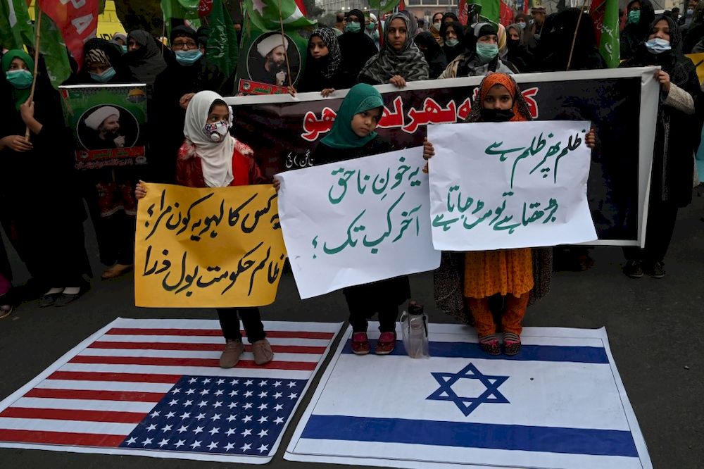 Shiite Muslims protest against the killing of miners of the Shiite Hazara community who were killed in an attack by gunmen in the mountainous Machh area, in Lahore on January 4, 2021. u00e2u20acu201d AFP pic