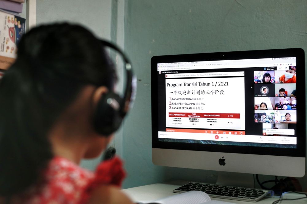 A Standard One student takes online lessons as classes resume January 20,2021. u00e2u20acu201d Picture by Ahmad Zamzahuri