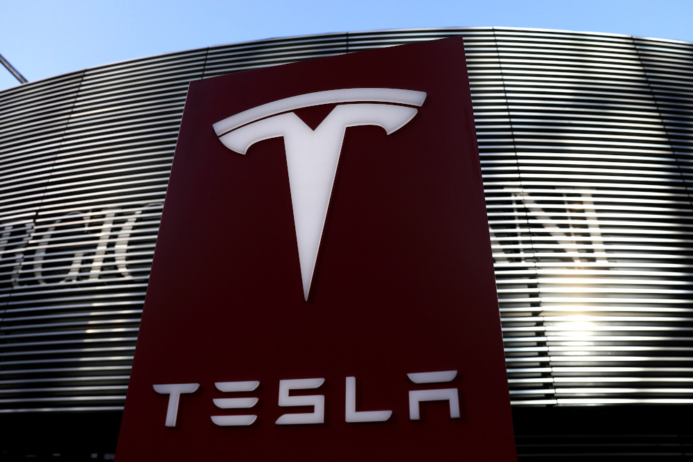 A logo of electric vehicle maker Tesla is seen near a shopping complex in Beijing, China, January 5, 2021. u00e2u20acu201d Reuters picnn