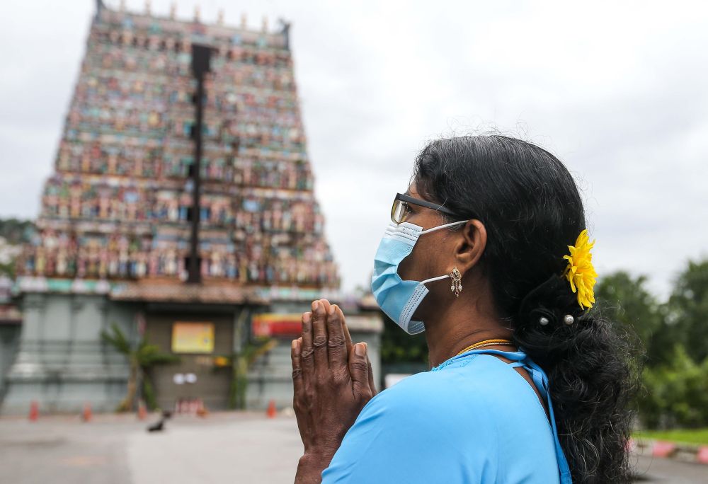 A Hindu devotee prays at the Kallumalai Arulmigu Subramaniyar Temple in Ipoh during Thaipusam January 28, 2021. u00e2u20acu201d Picture by Farhan Najib