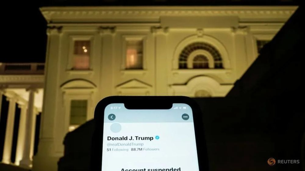 A photo illustration shows the suspended Twitter account of US President Donald Trump on a smartphone and the White House in Washington, US, January 8, 2021. u00e2u20acu201d Reuters pic