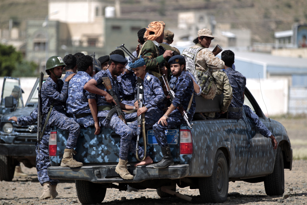 In this file photo taken September 17, 2019, Yemeni Shiite Huthi police forces sit in the back of a military vehicle in the capital Sanaa during a protest against the Saudi intervention in their country. u00e2u20acu201d AFP pic 