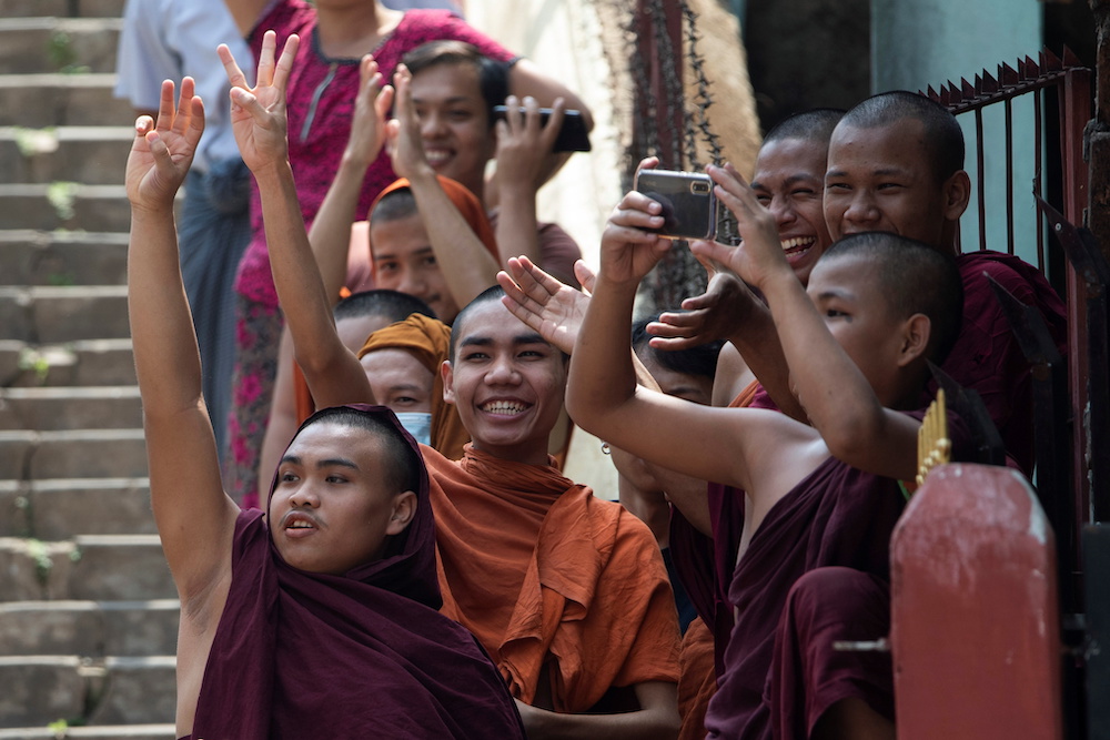 Buddhist monks show the three-finger salute as they take part in a protest against the military coup and to demand the release of elected leader Aung San Suu Kyi, in Yangon, Myanmar February 7, 2021. u00e2u20acu201d Reuters pic