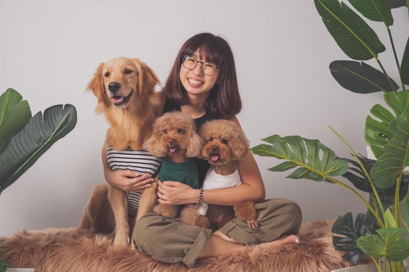Yenn pictured with her Golden Retriever Wonz and her two Poodles Miler and Browny. — Picture courtesy of Pet Pet Houzz