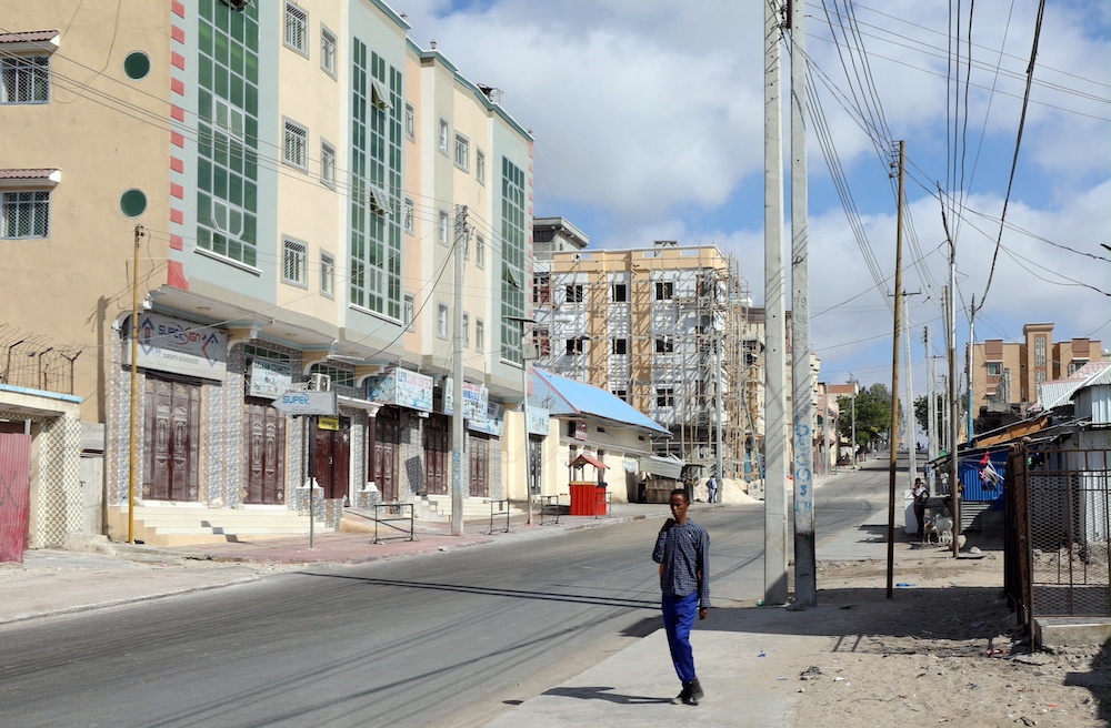 A Somali man walks on a street which is sealed off to prevent a protest over delayed elections in Mogadishu, Somalia February 19, 2021. u00e2u20acu201d Reuters pic