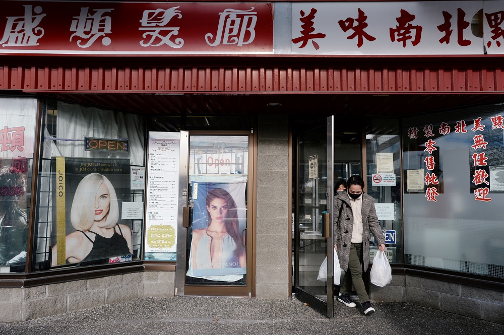 A customer exits Delicious Dim Sum, next door to the Hong Kong Washington Salon in Richmond, British Columbia, Canada January 26, 2021. — Reuters pic