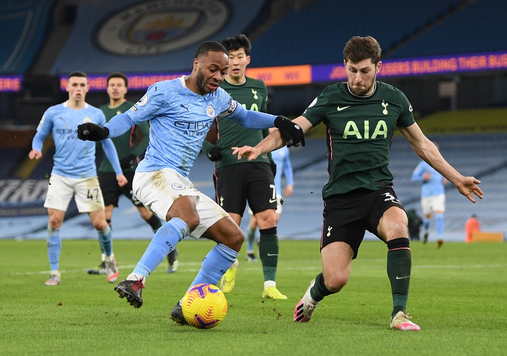 Manchester City's Raheem Sterling in action with Tottenham Hotspur's Ben Davies during the match at the Etihad Stadium in Manchester February 13, 2021. u00e2u20acu201d Pool pic via Reuters