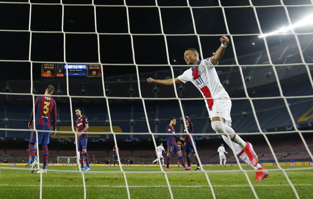 Paris St Germain's Kylian Mbappe celebrates their third goal scored by Moise Kean at the Camp Nou stadium in Barcelona February 16, 2021. u00e2u20acu201d Reuters pic