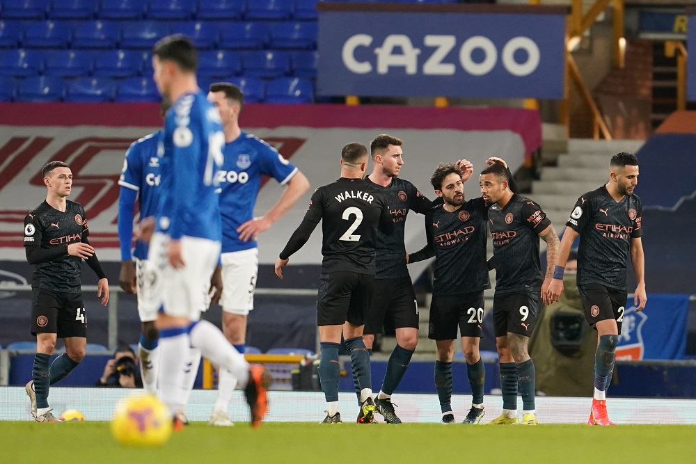 Manchester City's Bernardo Silva celebrates scoring their third goal with Gabriel Jesus and teammates at Goodison Park in Liverpool February 17, 2021. u00e2u20acu201d Pool pic via Reuters